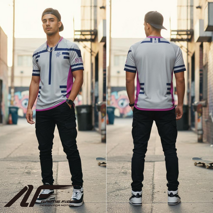 Man wearing a gray and pink Demon Slayer Anime Jersey with black pants on an urban street.